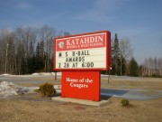 Sign: "Katahdin Middle & High School, Home of the Cougars" in Stacyville