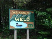 sign: "Welcome to Weld, 1816" with Loon on Route 156 (2008)