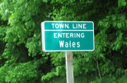 sign: "Town Line, Entering Wales" (2012)