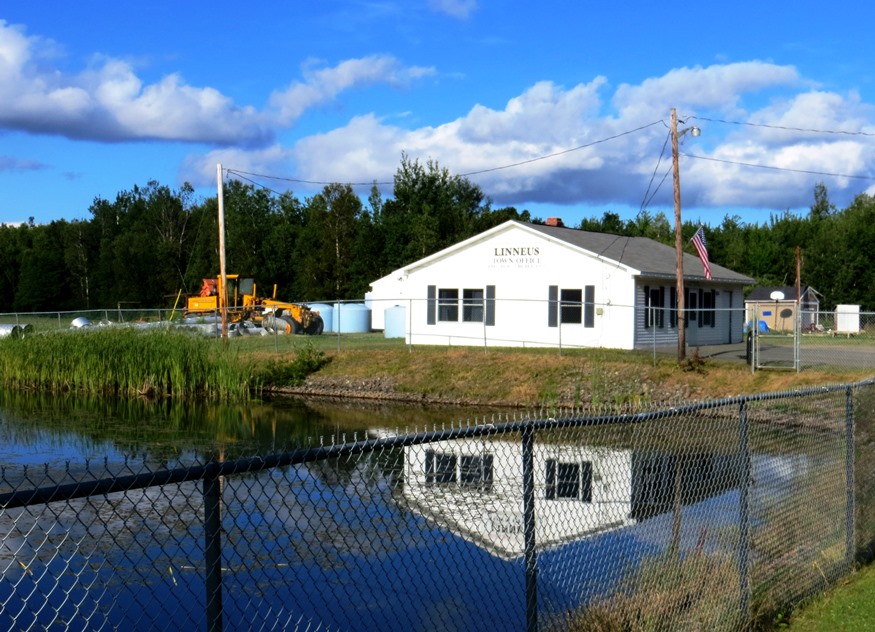 Linneus Town Office near a pond likely to provide water to the firedepartment (2012)