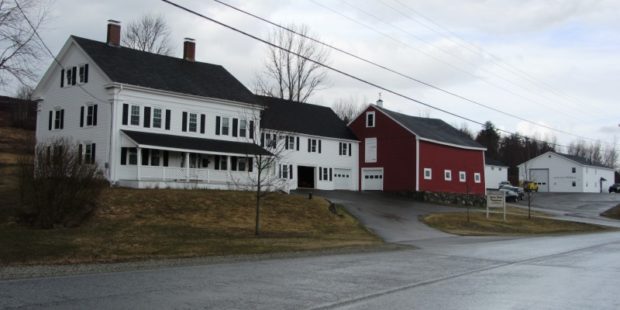 Large House and Red Barn with sign: Union River Telephone @