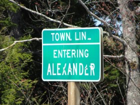 sign: Town Line, Entering Alexander (2013)
