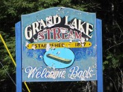 Sign: Grand Lake Stream, Welcome Back, on the Milford Road