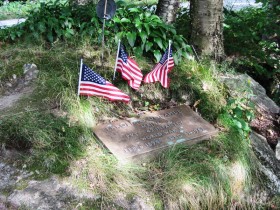World War I Veterans Memorial for Errold O. Donahue near a USGS Survey Marker off Route 113 in the White Mountain National Forest in Stow