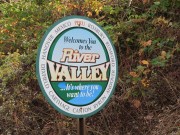 Sign: . . . Welcomes You to the River Valley . . . ." on Route 108 in West Peru