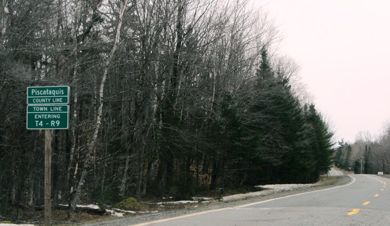 sign: "Piscataquis County Line, Entering T4 R9" (NWP) on Route 11 (2014)