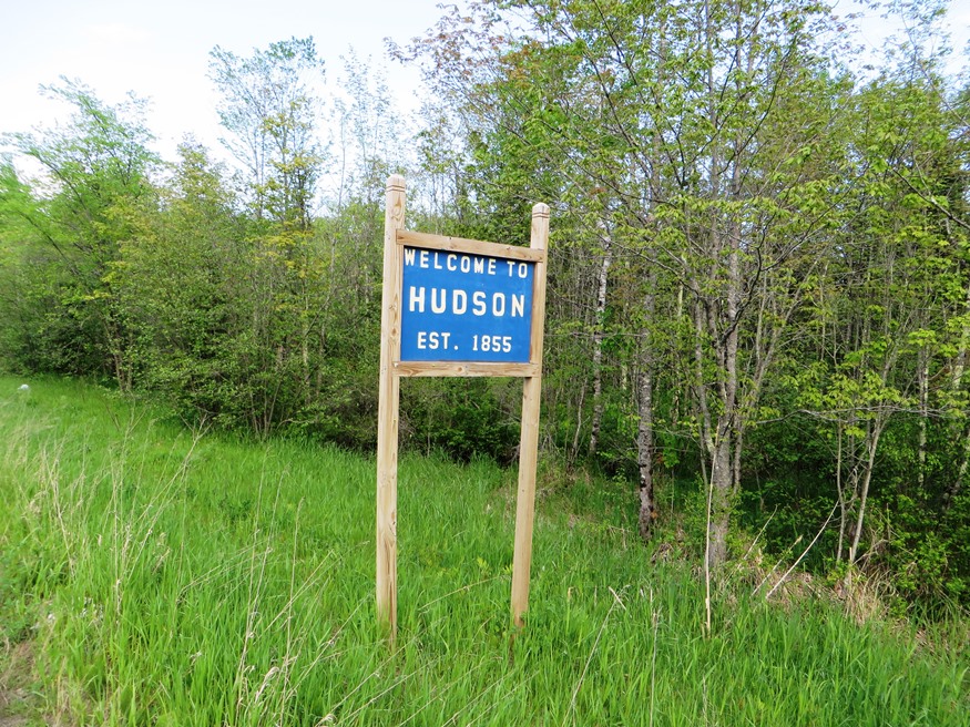 sign: "Welcome to Hudson"